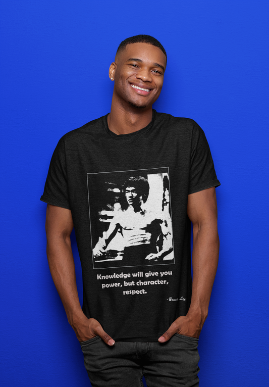 Smiling man wearing inspirational Bruce Lee graphic t-shirt in WaterDragon Apparel studio