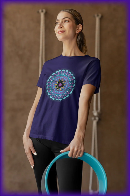 Woman wearing navy blue mandala print t-shirt holding a teal fitness yoga wheel against beige background